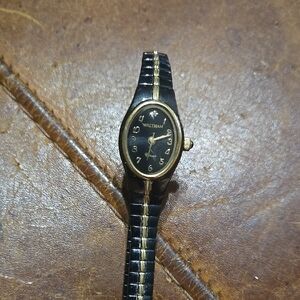Waltham Black and Gold Colored Watch. Needs Battery. Stetchy.
